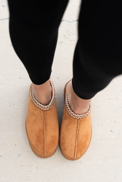 Tan suede clogs with trim