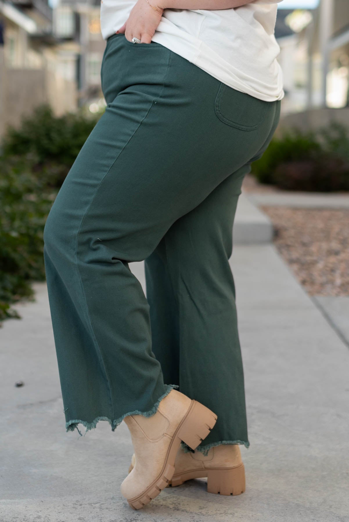 Side view of plus size hunter green wide leg pants