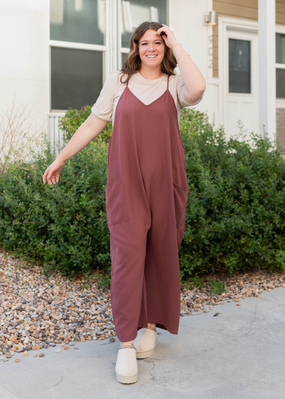 Front view of the plus size mahogany woven overalls