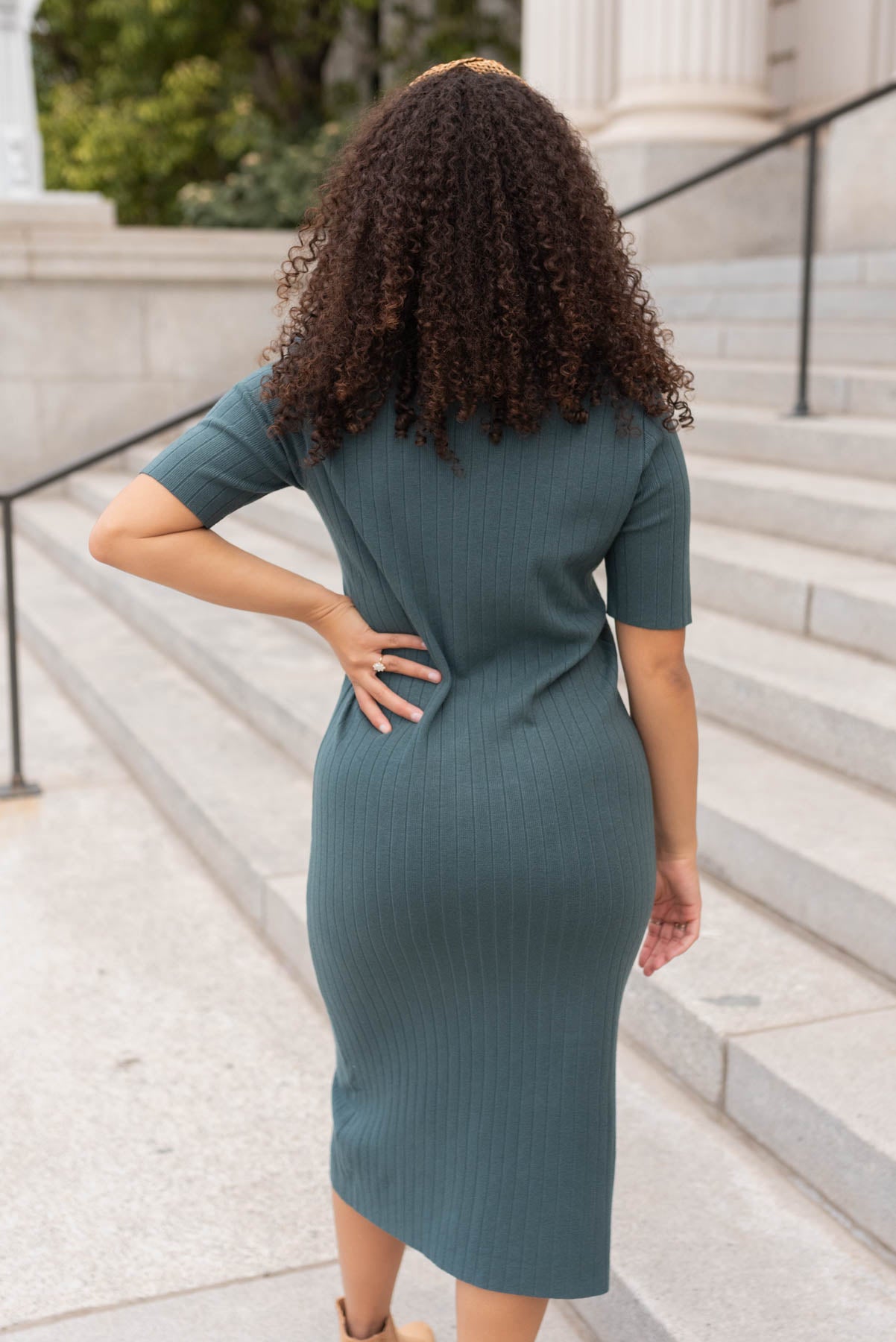 Back view of the dark green sweater dress