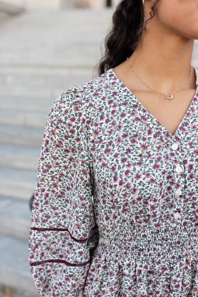 Close up of the fabric on the burgundy floral dress