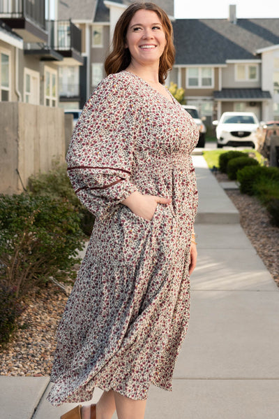 Side view of the plus size burgundy floral dress