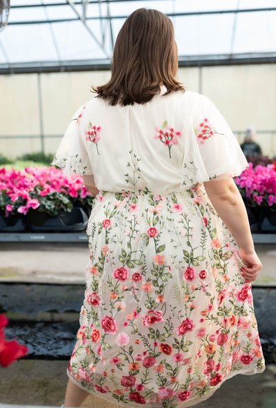 Back view of the pink embroidered mesh dress