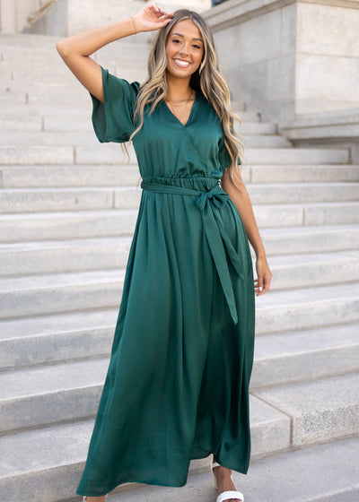 Front view of a short sleeve hunter green satin dress