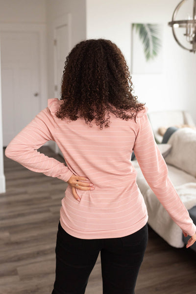 Back view of a mauve stripe ruffle top