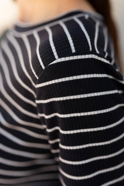 Close up of the sleeve and fabric on the navy stripe ribbed top