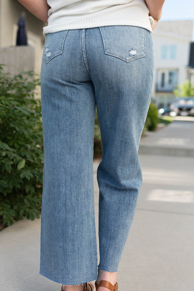 Back view of the medium wash wide leg jeans