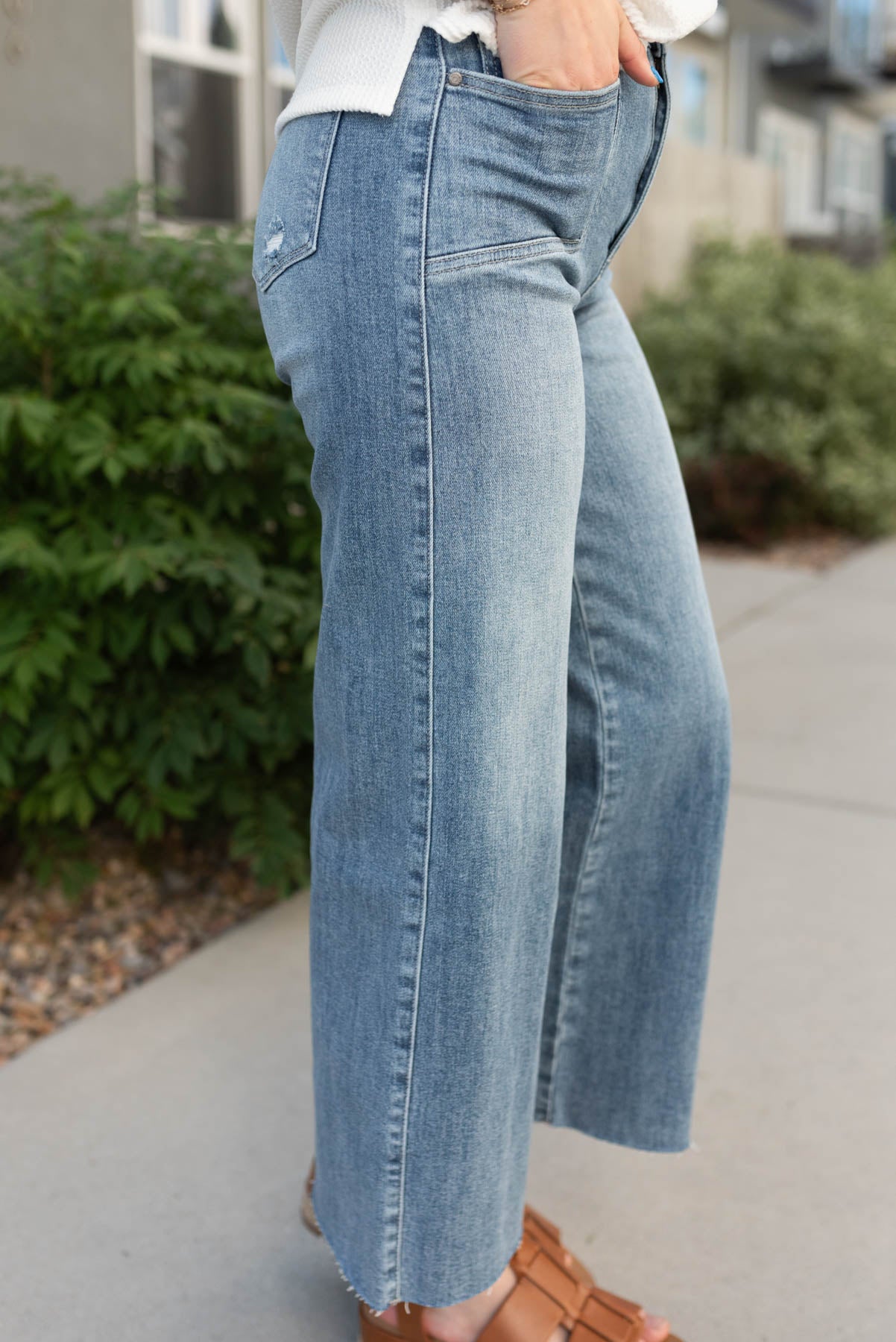 Side view of the medium wash wide leg jeans