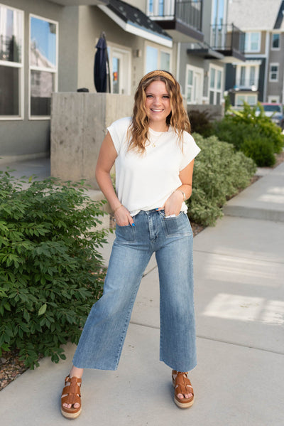 Medium wash wide leg jeans with a slight crop