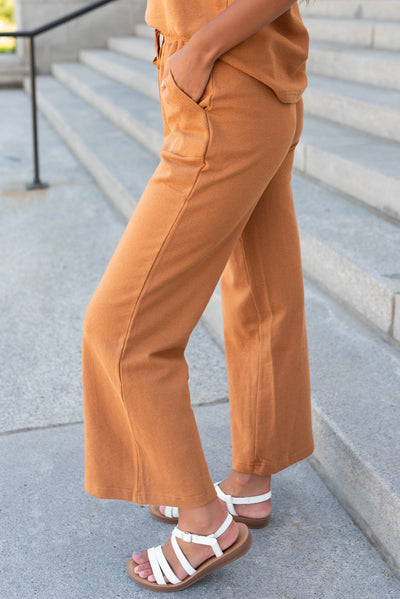 Side view of the camel wide leg pants with pockets