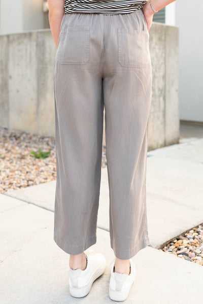 Back view of the grey drawstring wide leg pants