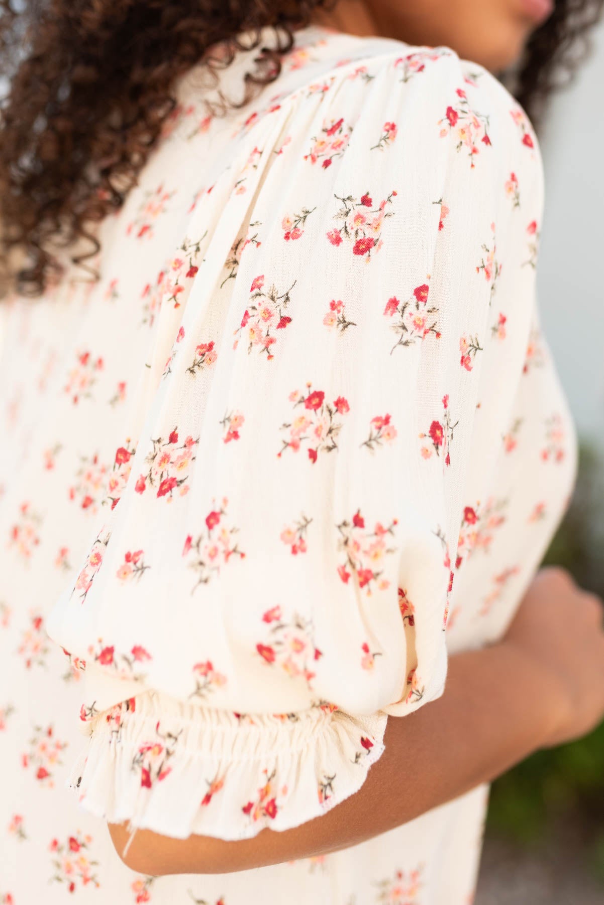 Close up of the cream floral top with pink flowers