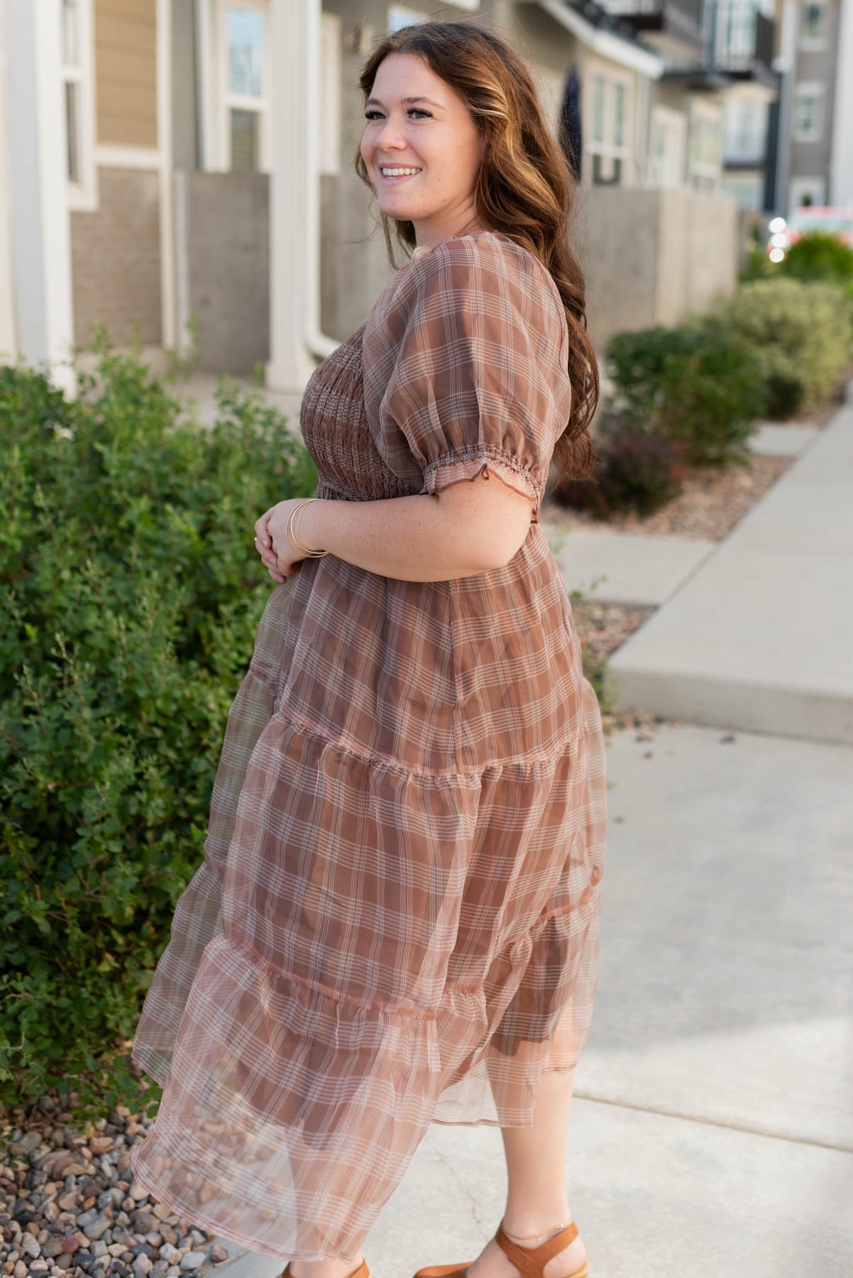 Side view of the plus size brown plaid dress