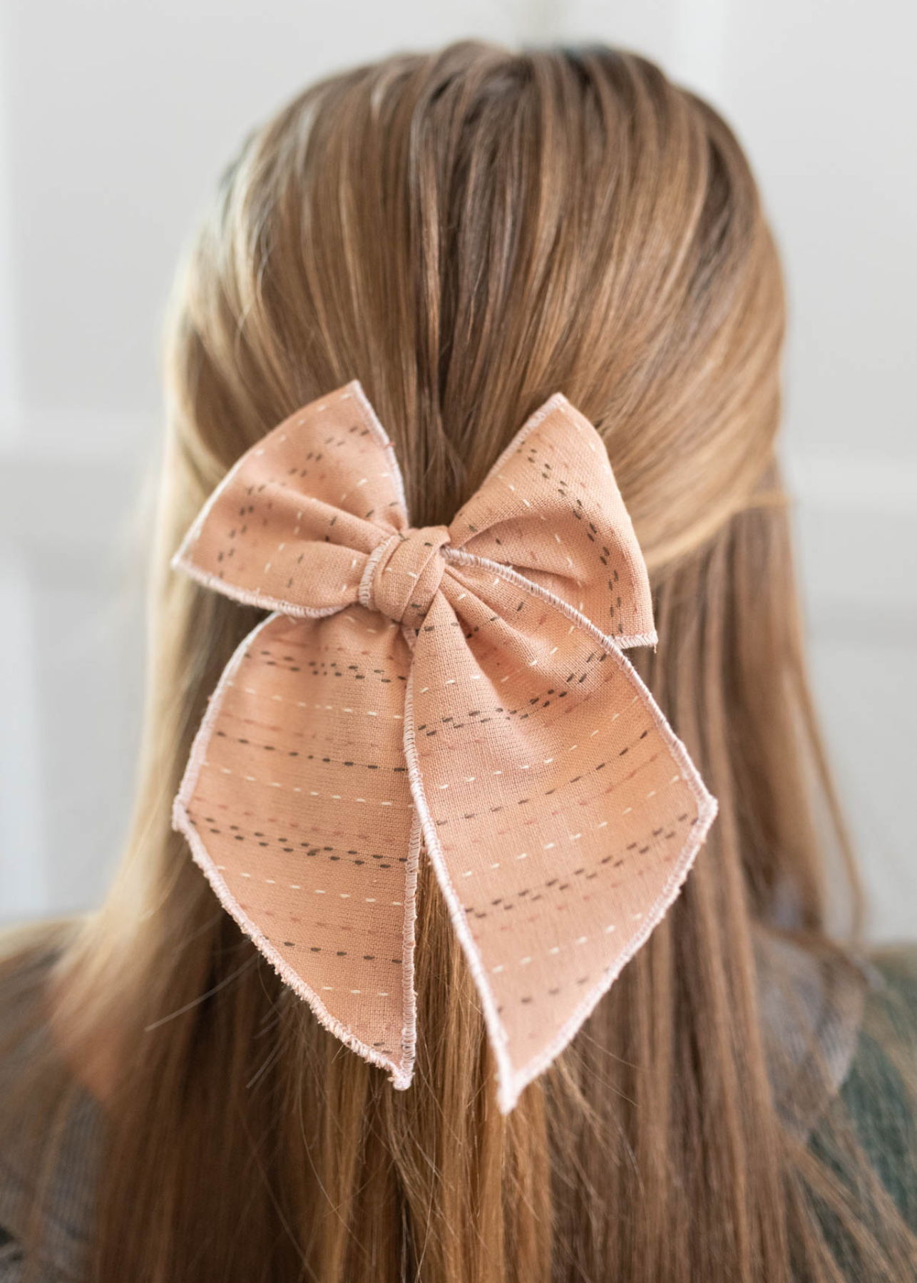 Mauve stitched bow