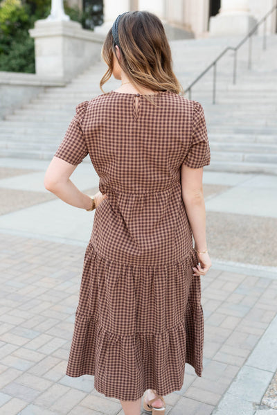 Back view of the brown gingham dress