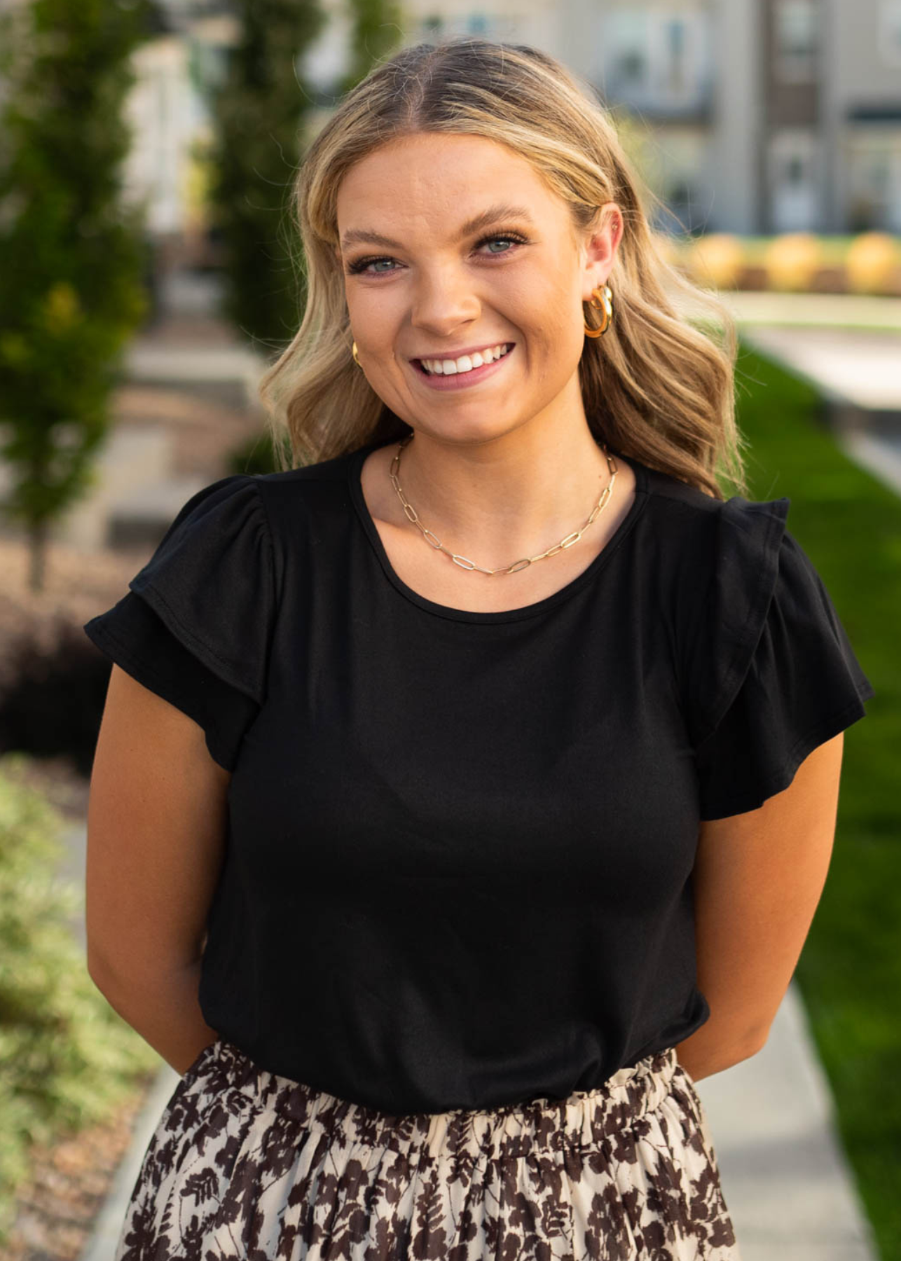 Knit black top with short ruffle sleeves