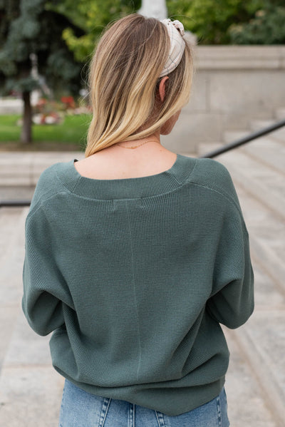 Back view of the jade button down cardigan