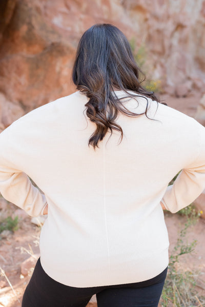 Back view of the sand beige button down cardigan