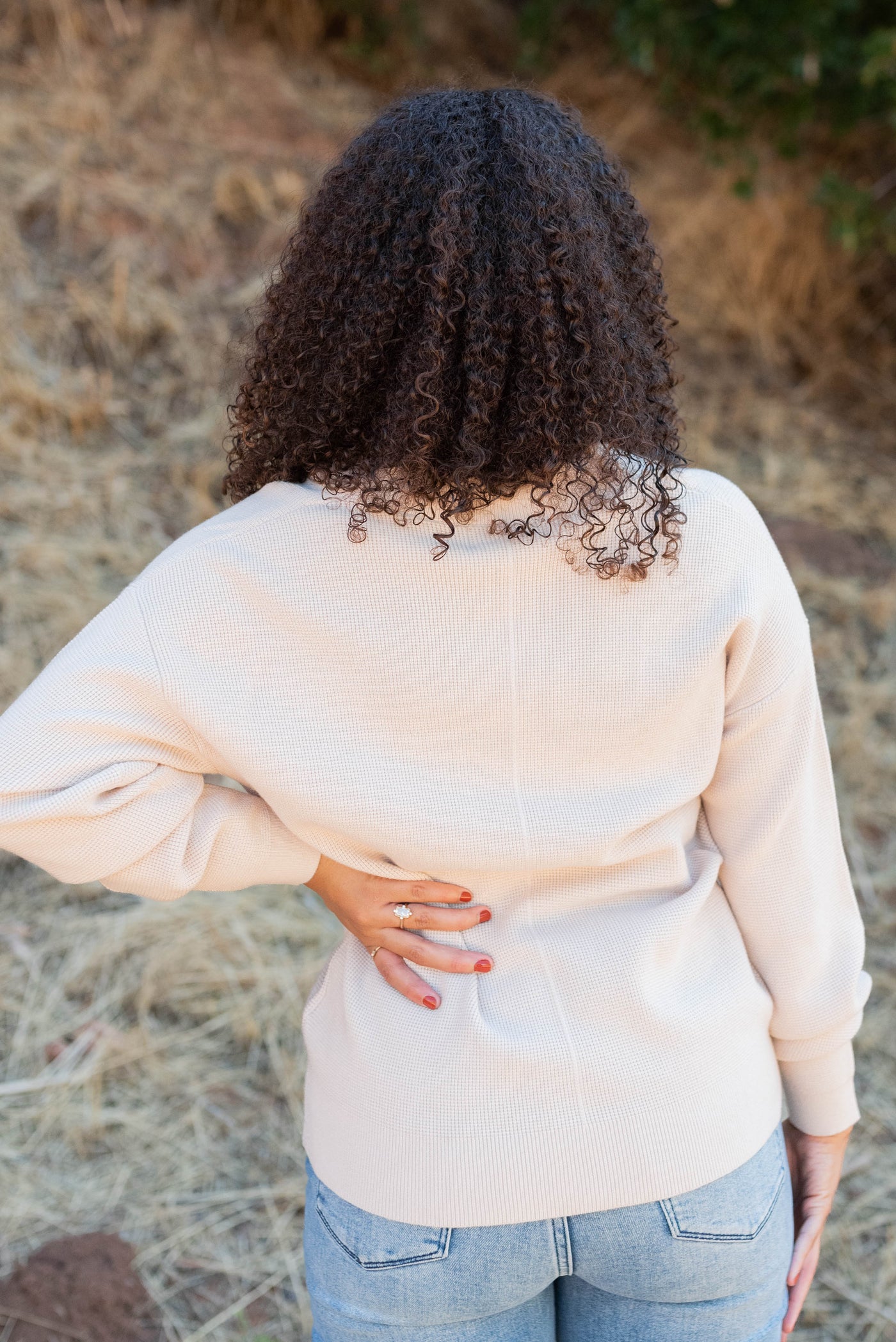 Back view of the sand beige button down cardigan