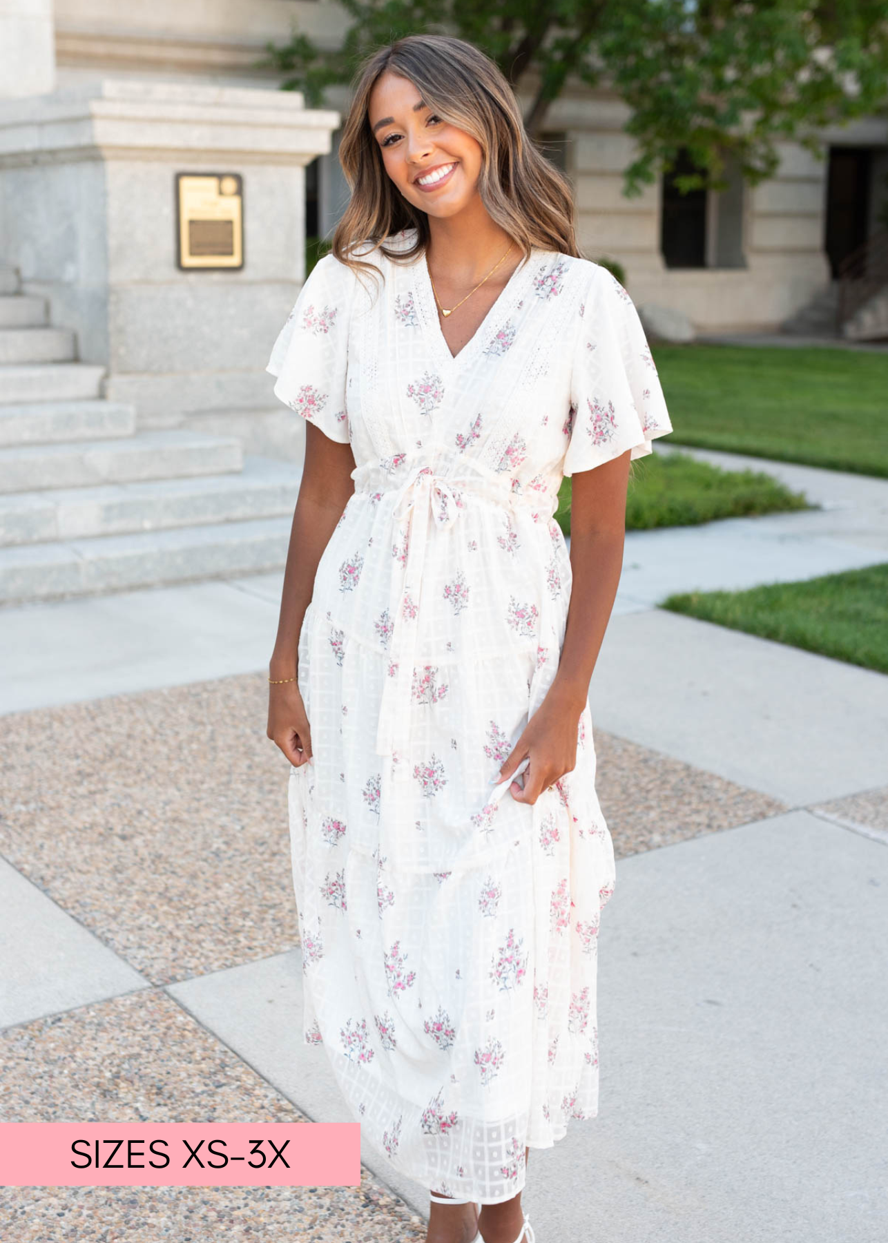 Cream floral tiered dress withshort sleeves and v-neck