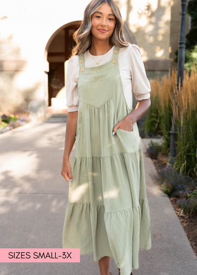 Sage green overall dress with button straps