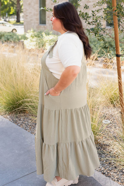 Side view of the plus size sage gree overall dress