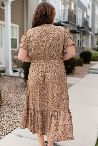 Back view of taupe black dot dress