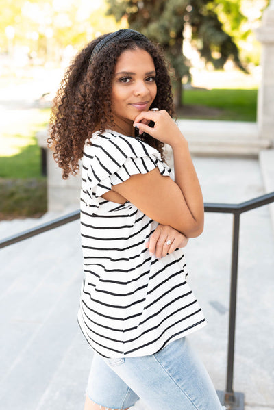 Side view of the black stripe ruffle top