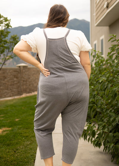 Back view of a plus size charcoal jumpsuit