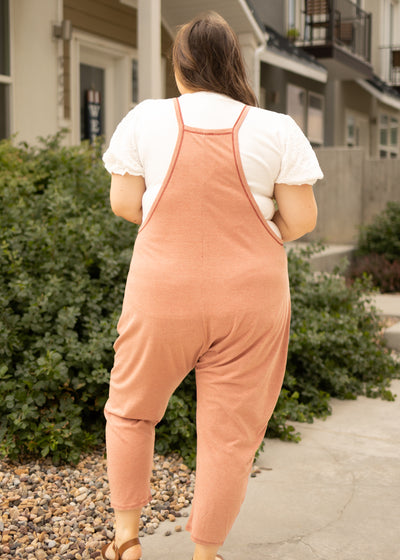 Back view of a plus size terracotta jumpsuit