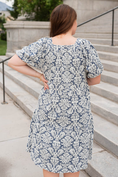 Back view of the navy multi floral dress in plus size