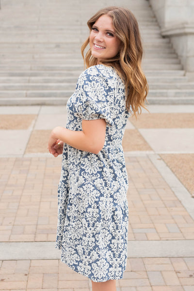 Side view of the navy multi floral dress