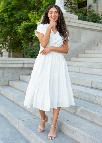 White collared tiered dress with short sleeves