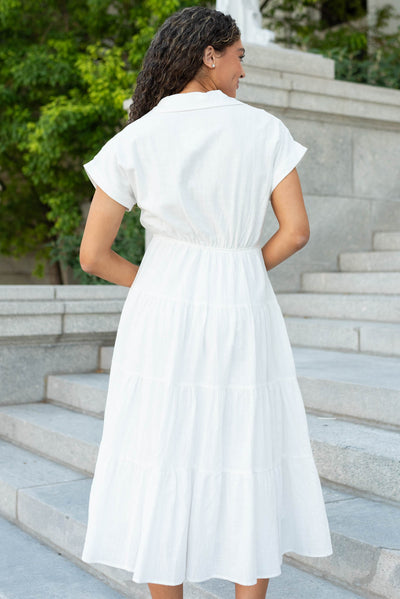 Back view of the white collared tiered dress