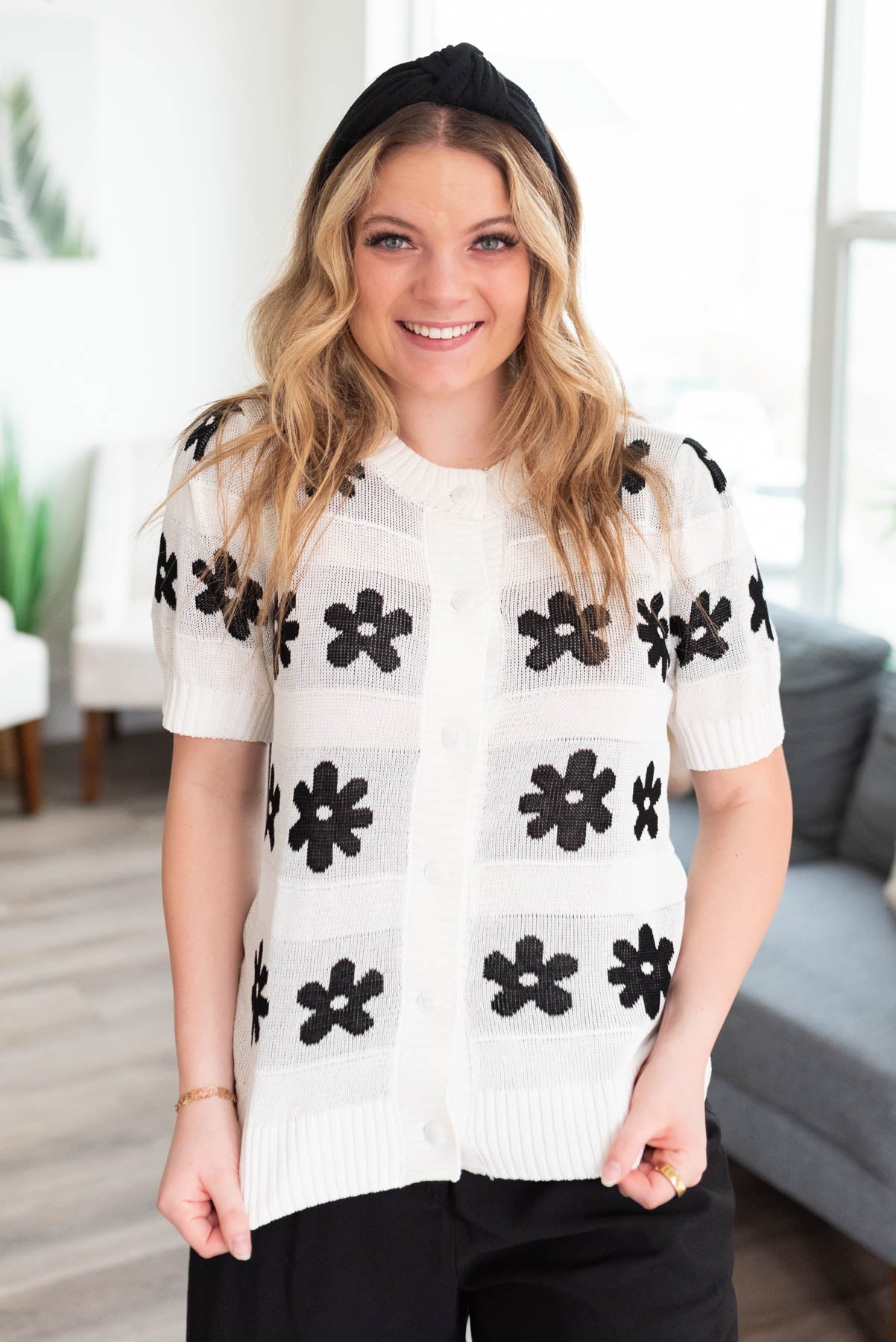 Front view small button up ivory floral short sleeve sweater