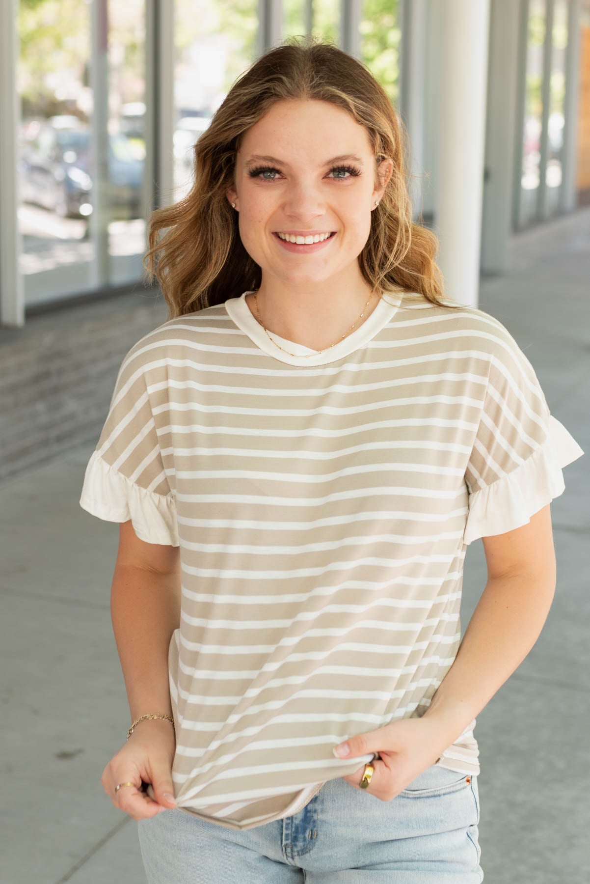 Taupe stripe top with white ruffle on the cuff