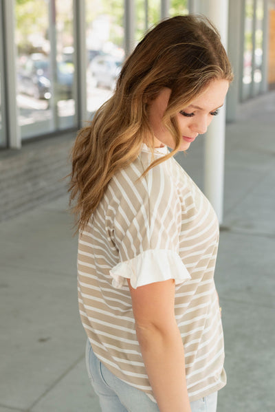 Side view of the taupe stripe top