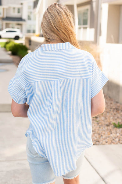 Back view of the sky blue polo shirt