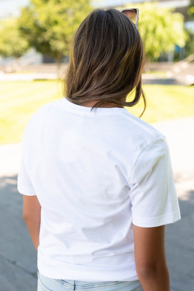 Back view of the white bow grid top