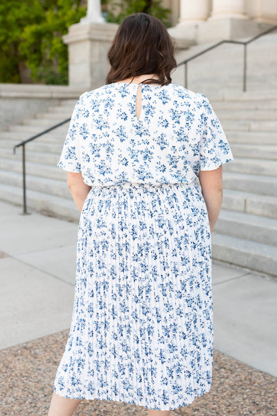 Back view of the blue floral pleated dress