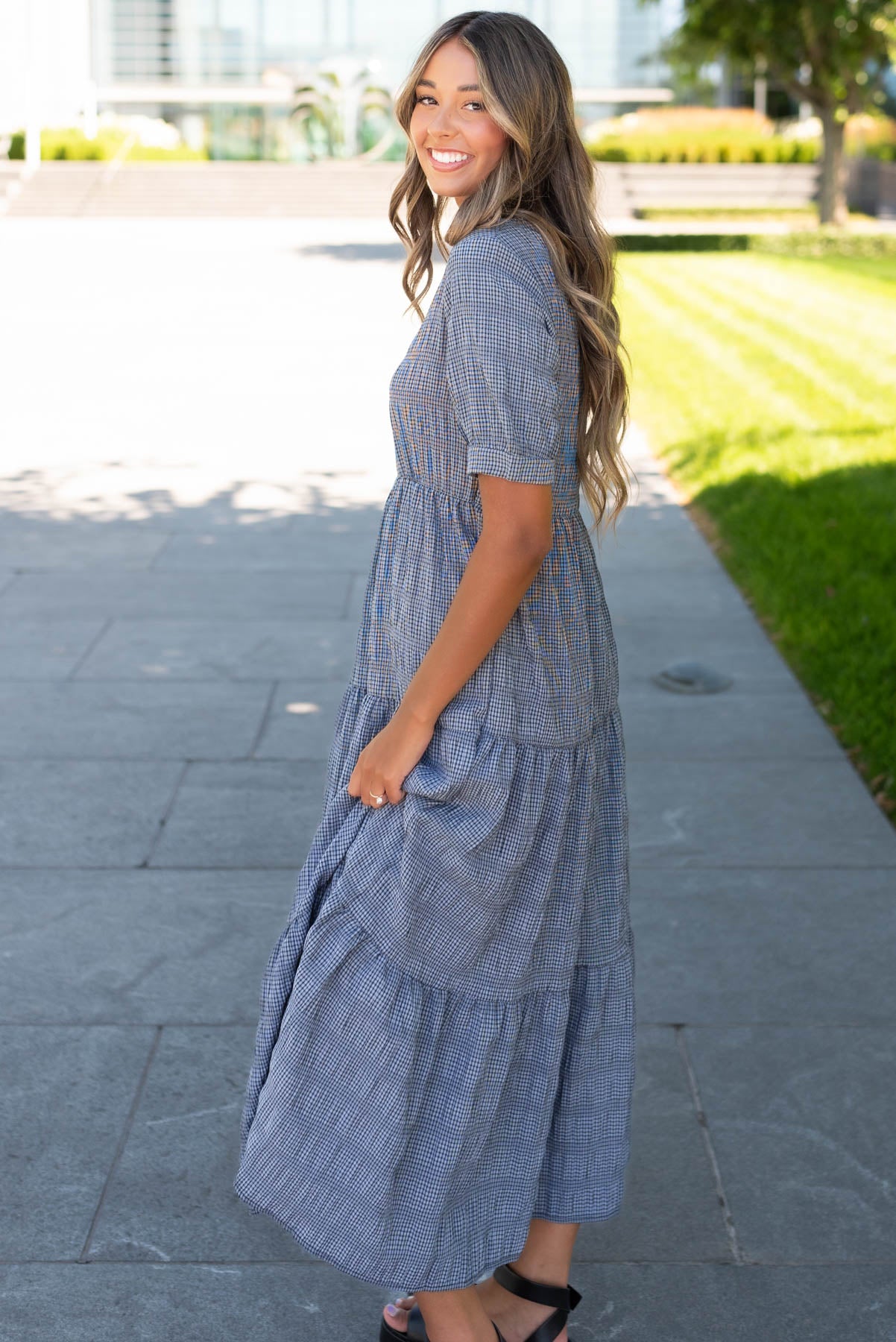 Side view of the charcoal gingham dress