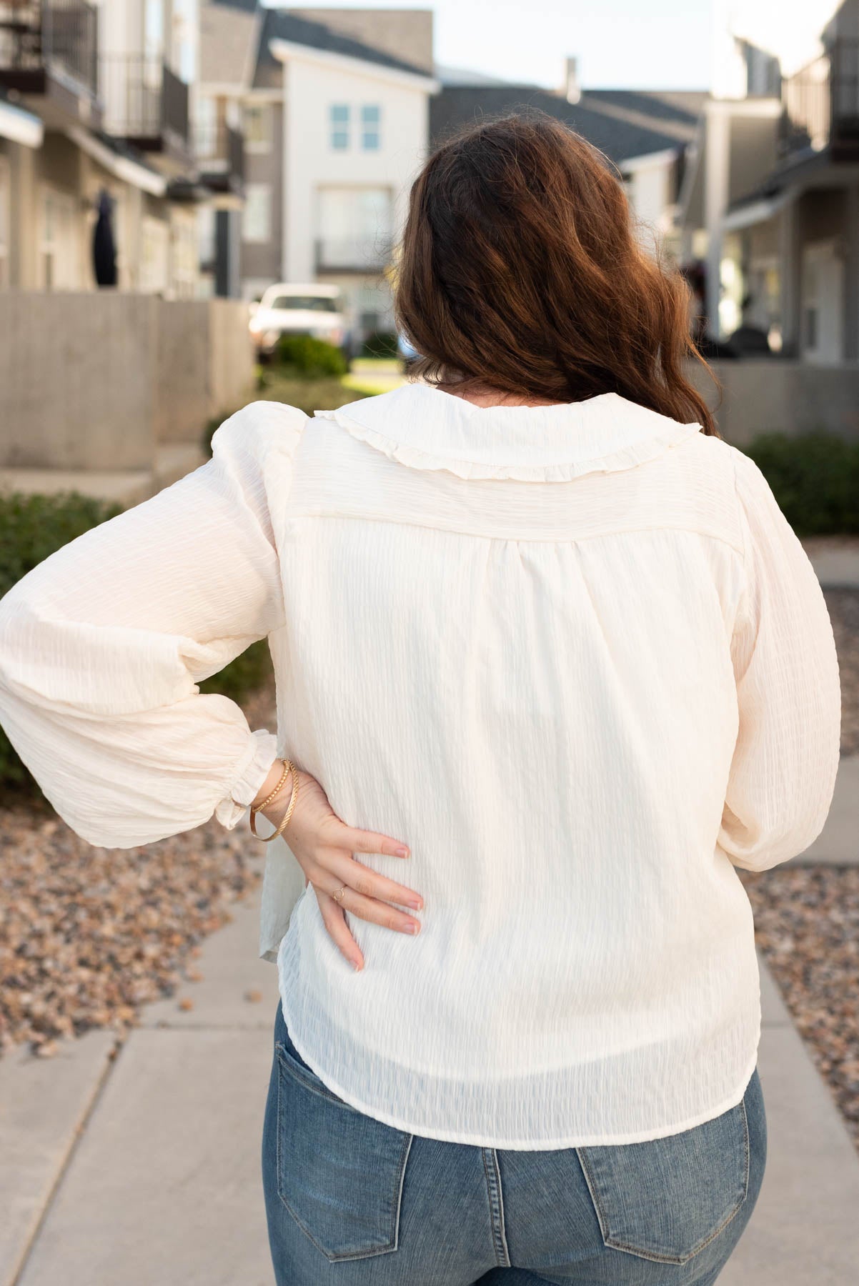 Back view of the plus size cream long sleeve top