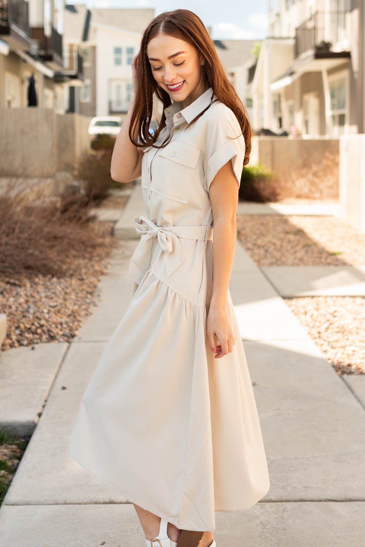 Side view of the beige button down dress