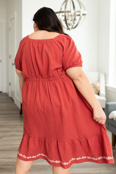 Back view of a plus size red dress