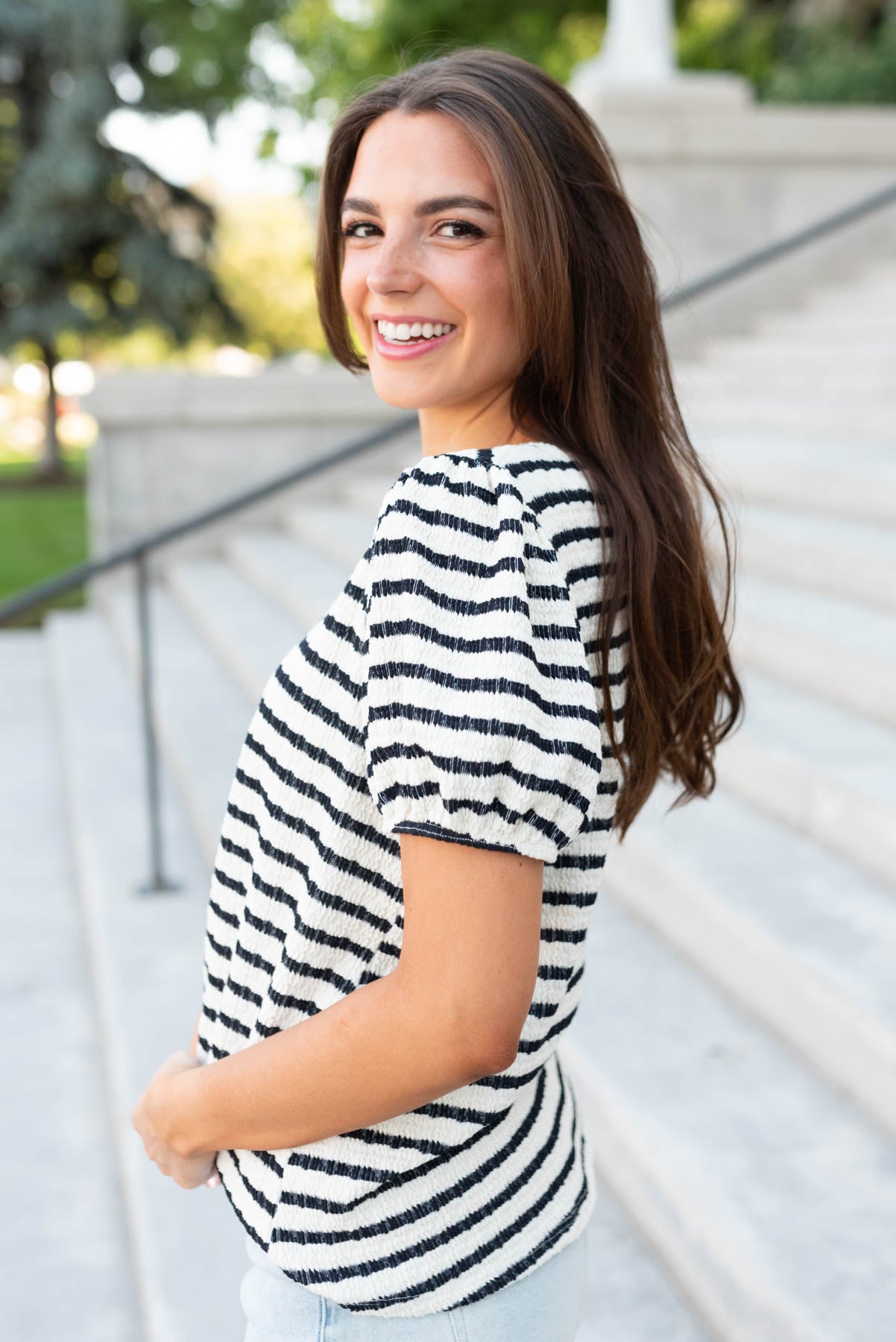 Side view of the navy stripe texture top