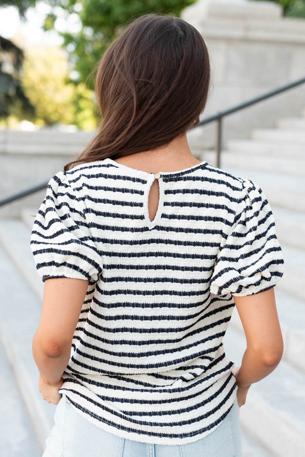 Back view of the navy stripe textrued top