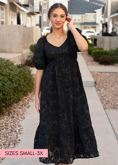 Black tiered floral dress with daisy print