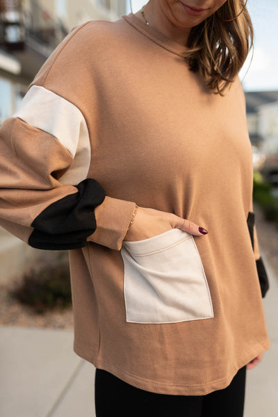 Close up of the mocha color block pullover