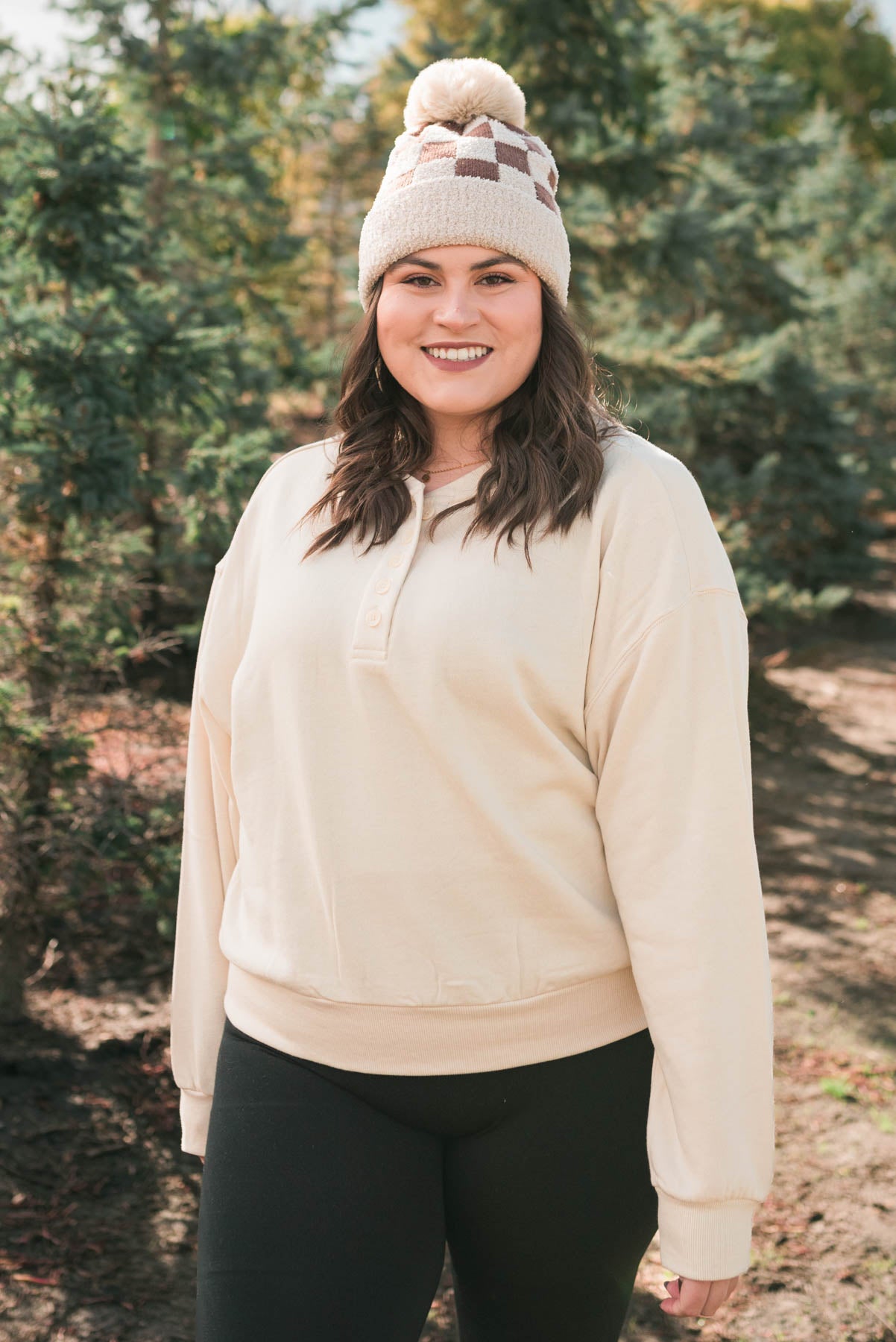 Taupe checkered beanie with a pompom