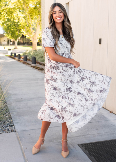 Cream floral smocked dress with short sleeves